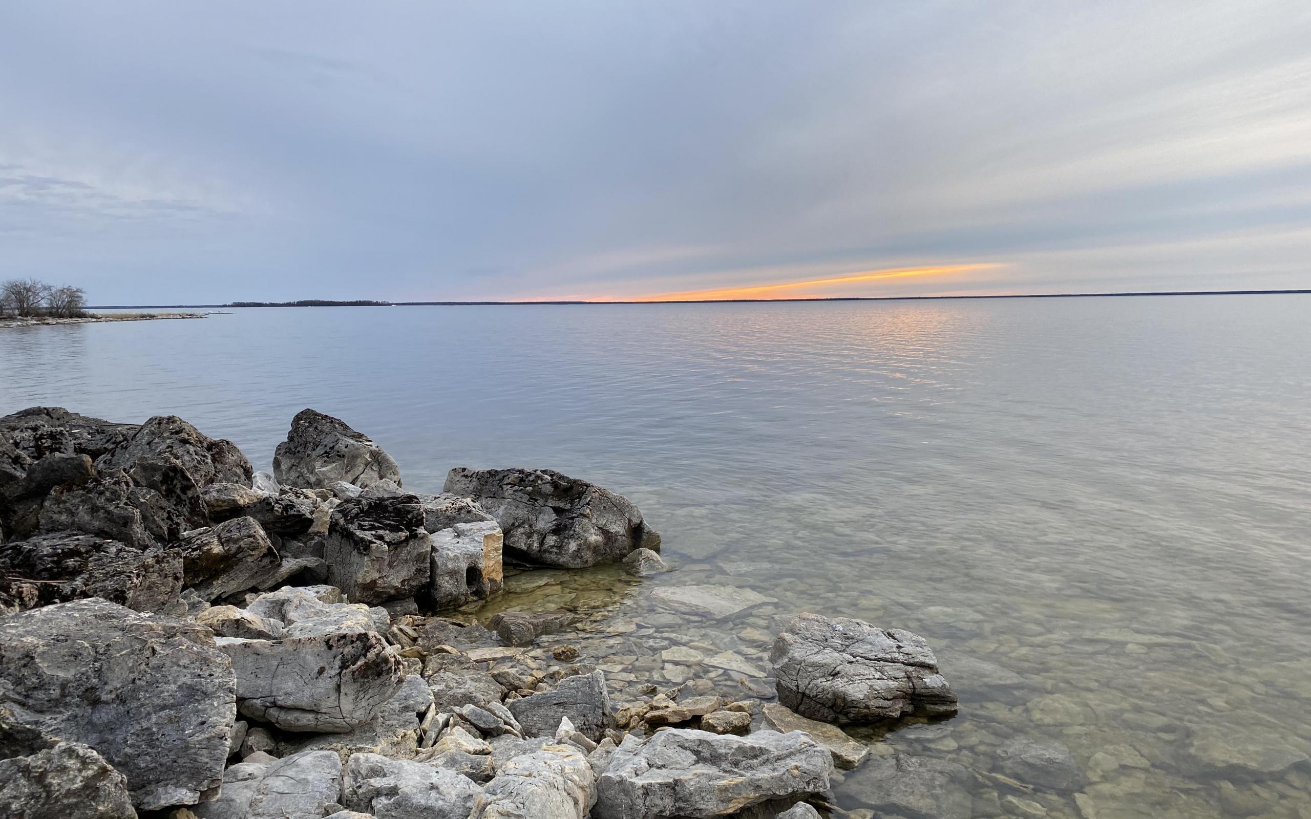 The shores of Cedar Lake, Manitoba, during a sunset.